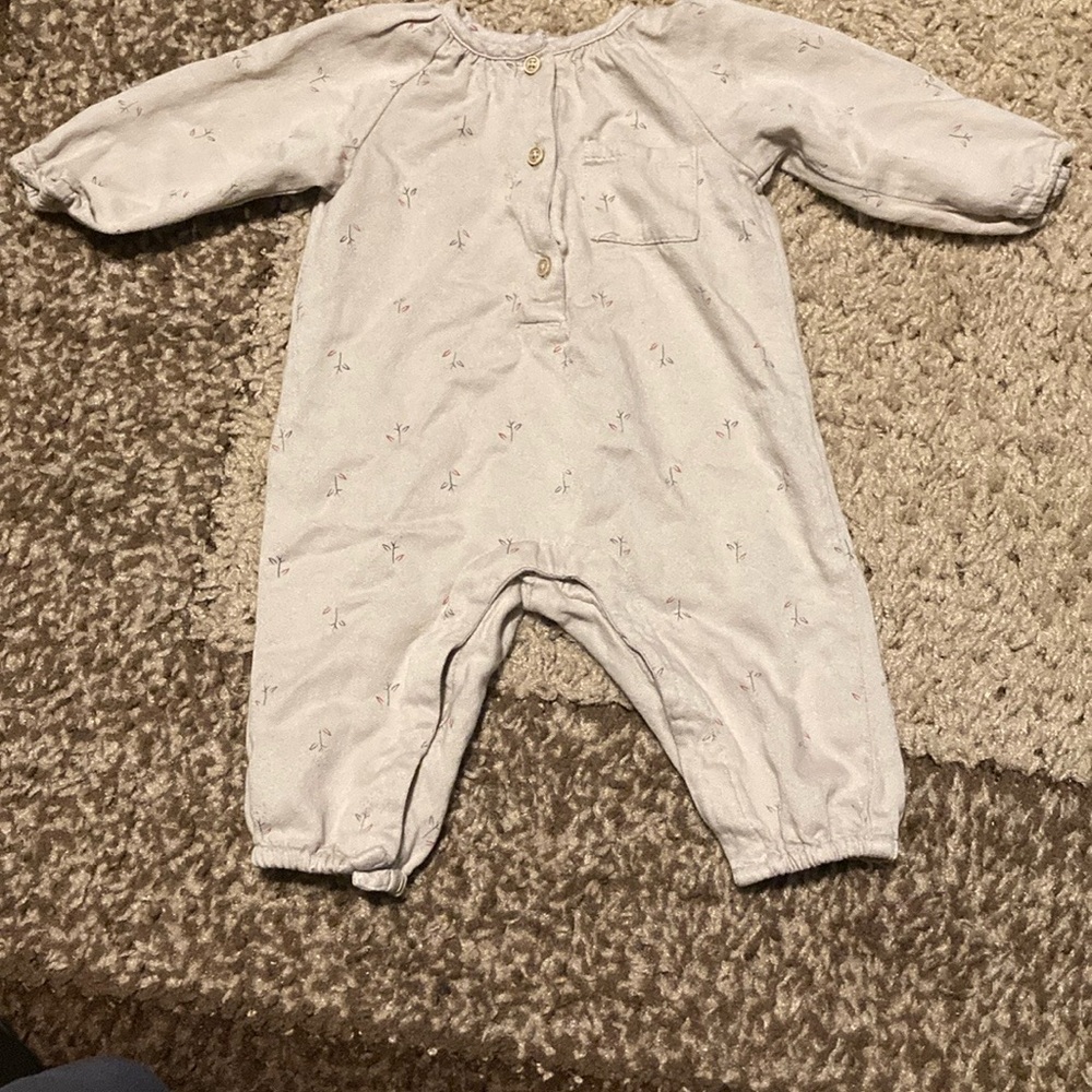 Zara Kids One Piece in Light Beige with little flowers on it.